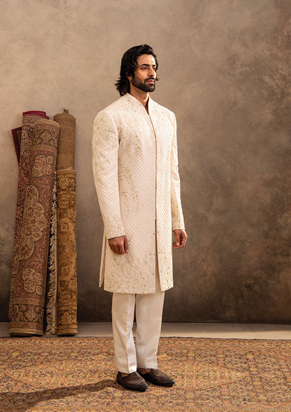 Ivory Regal Sherwani Set with Detailed Handwork and Shawl Draping Finish
