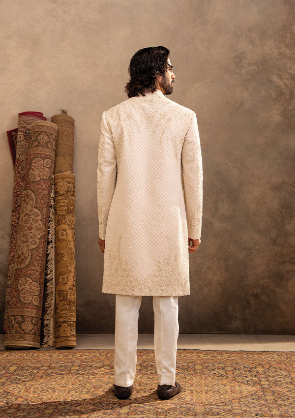 Ivory Regal Sherwani Set with Detailed Handwork and Shawl Draping Finish